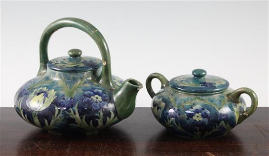 A Moorcroft late Florian tea kettle and cover, and a matching sugar bowl and cover, c.1915, teapot 16.5cm, both with repairs